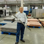 engineer-holding-ti-clad-bar