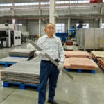 engineer-holding-titanium-clad-bar